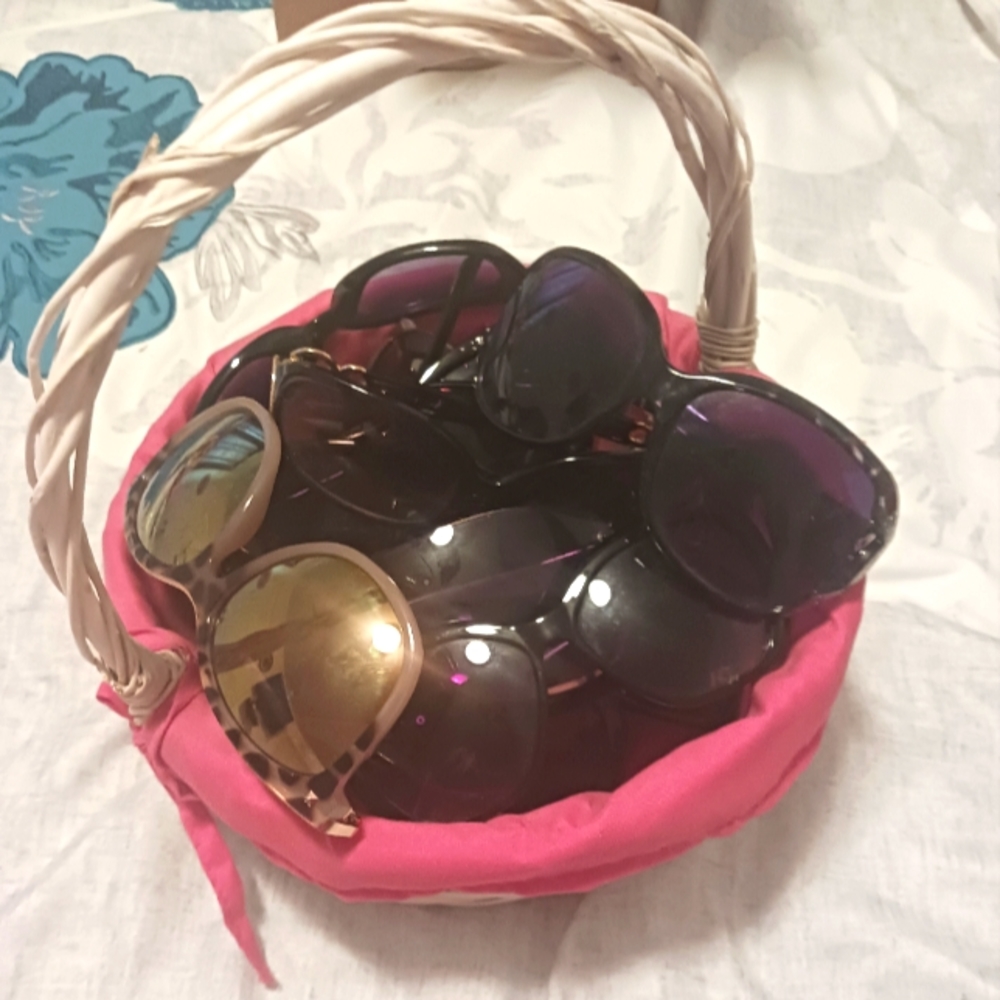 Basket full of 14 sunglasses